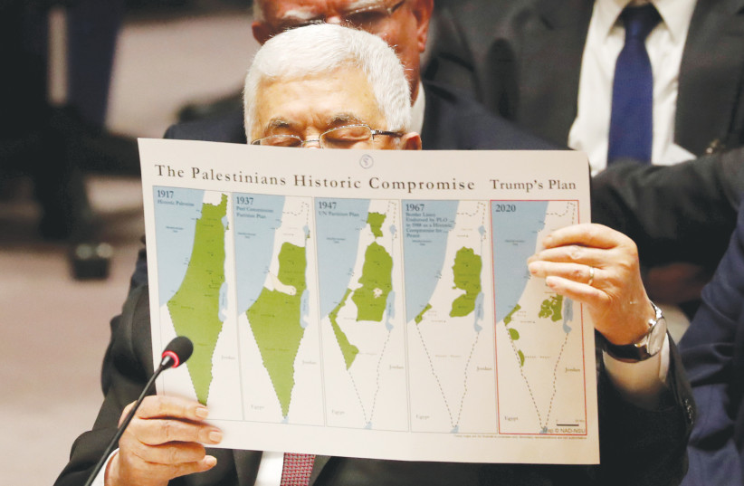 PALESTINIAN AUTHORITY President Mahmoud Abbas holds up maps of the Palestinian compromise, addressing the UN Security Council, in 2020. But after the 1947 Partition Plan, local Arab leaders encouraged Palestinian Arabs to flee, says the writer.  (photo credit: SHANNON STAPLETON/ REUTERS)