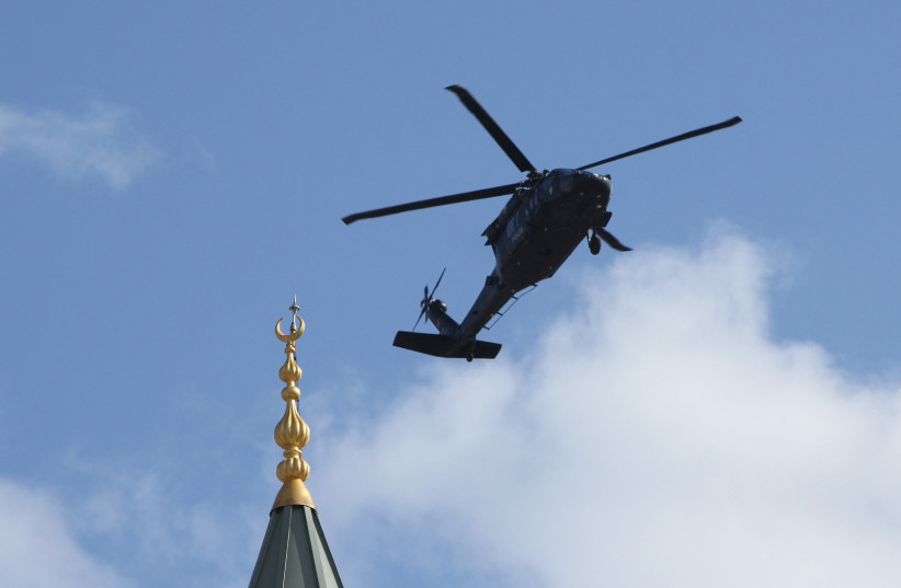  A police helicopter flies over a mosque as Turkish President Tayyip Erdogan attends a ceremony in Diyarbakir, Turkey April 14, 2023. (credit: REUTERS/SERTAC KAYAR)