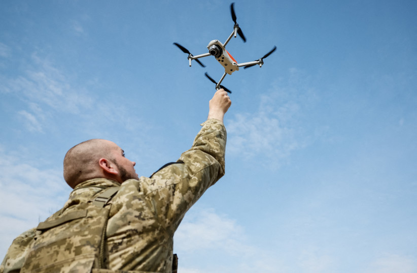  A recruit of the Steel Border storm brigade practises launching drones, at the unit's base in central Ukraine March 24, 2023. (credit: REUTERS/ALINA YARYSH)