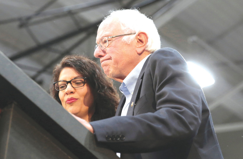  SEN. BERNIE SANDERS and Rep. Rashida Tlaib address a Sanders presidential campaign rally in Detroit in 2019. Last week, Sanders allowed Tlaib to host a ‘Nakba’ event on Capitol Hill (photo credit: REBECCA COOK/REUTERS)