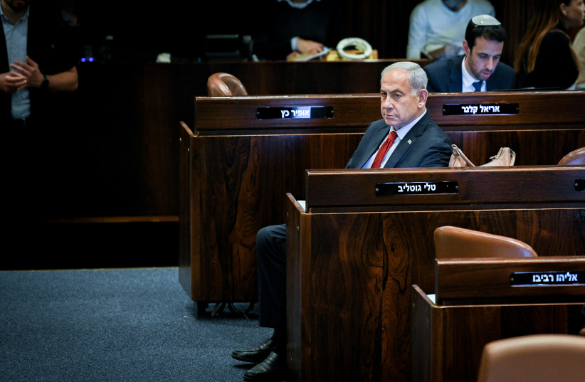  Prime Minister Benjamin Netanyahu seen during a discussion and a vote in the assembly hall of the Knesset, the Israeli parliament in Jerusalem, on May 15, 2023 (credit: Arie Leib Abrams/Flash90)