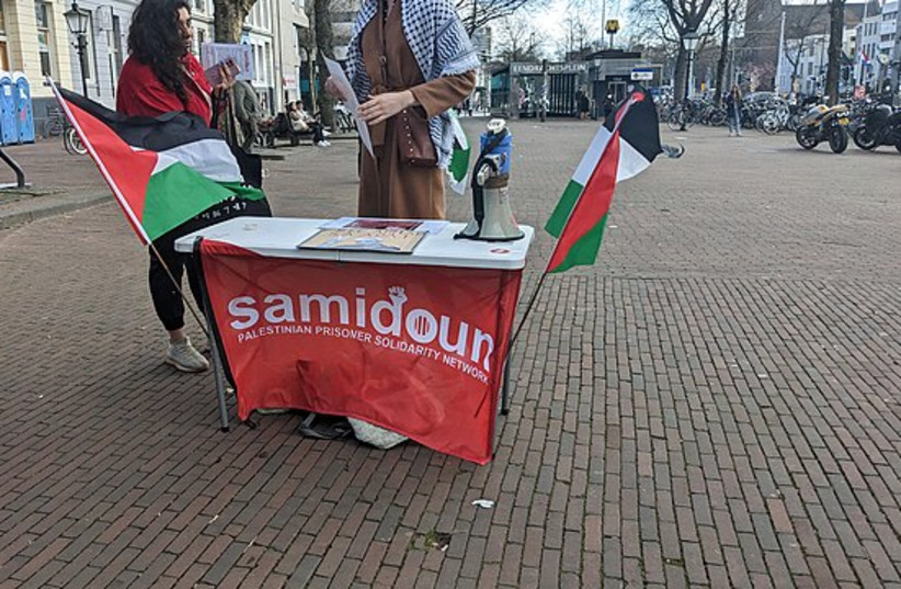  A Samidoun stand with Palestinian flags is seen in Rotterdam, Netherlands on March 28, 2023 (credit: VIA WIKIMEDIA COMMONS)
