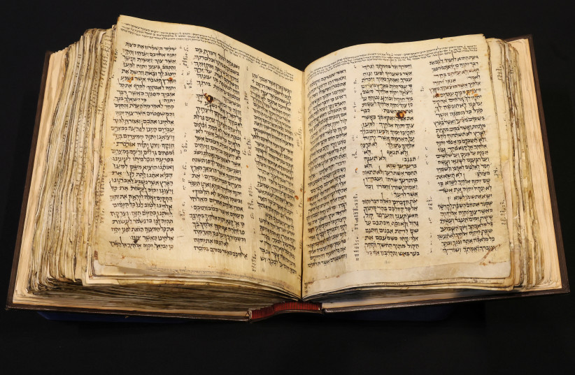  The Codex Sassoon, the earliest and most complete Hebrew Bible ever discovered which is estimated to sell for between $30 million and $50 million, is displayed at Sotheby's in New York City, New York US, February 15, 2023. (photo credit: REUTERS/BRENDAN MCDERMID)