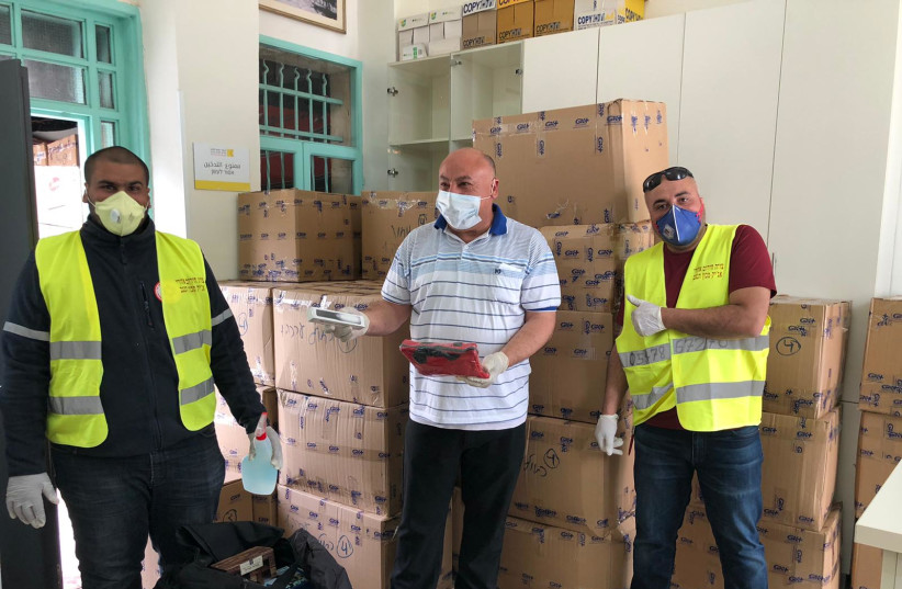  The Arab-Jewish Center for Empowerment, Equality, and Cooperation, supported by the UJA-Federation of New York, distributed hygiene and game kits to Bedouin families at various sites around Israel's Negev Desert during the coronavirus crisis (credit: Courtesy UJA-Federation of New York)