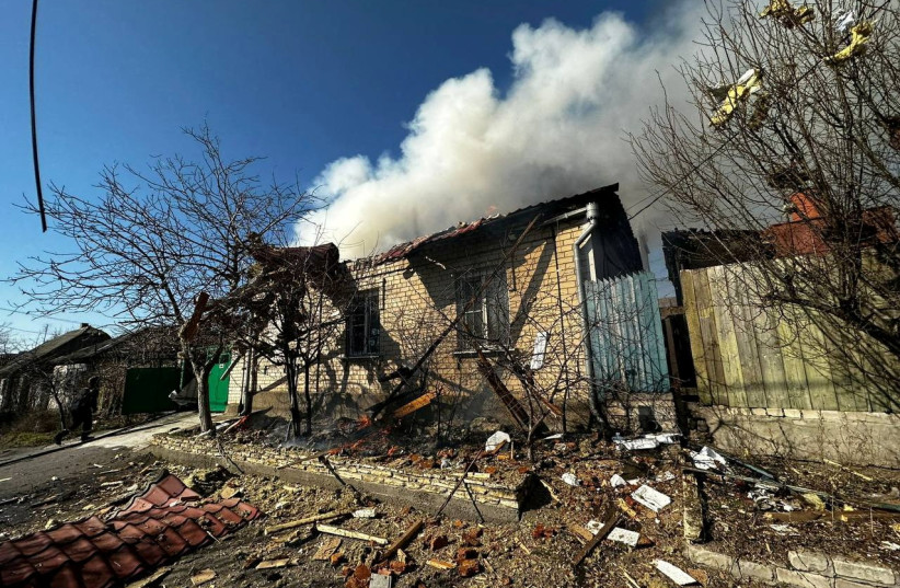 A burning residential house is seen after a Russian military strike, amid Russia's attack on Ukraine, in Kherson, Ukraine March 9, 2023. (photo credit: Andriy Yermak via Telegram/Handout via REUTERS)
