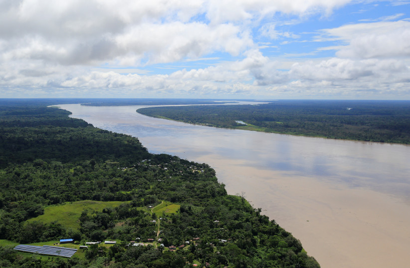  An aerial view of the Amazon river, before the signing of a document by Colombia's President Juan Manuel Santos that will allow for the conservation of the Tarapoto wetland complex in Amazonas, Colombia January 18, 2018. (photo credit: REUTERS/Jaime Saldarriaga)