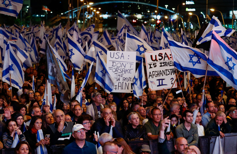  A close-up of people protesting against the judicial overhaul plan in Tel Aviv on April 29.  (credit: CORINNA KERN/REUTERS)