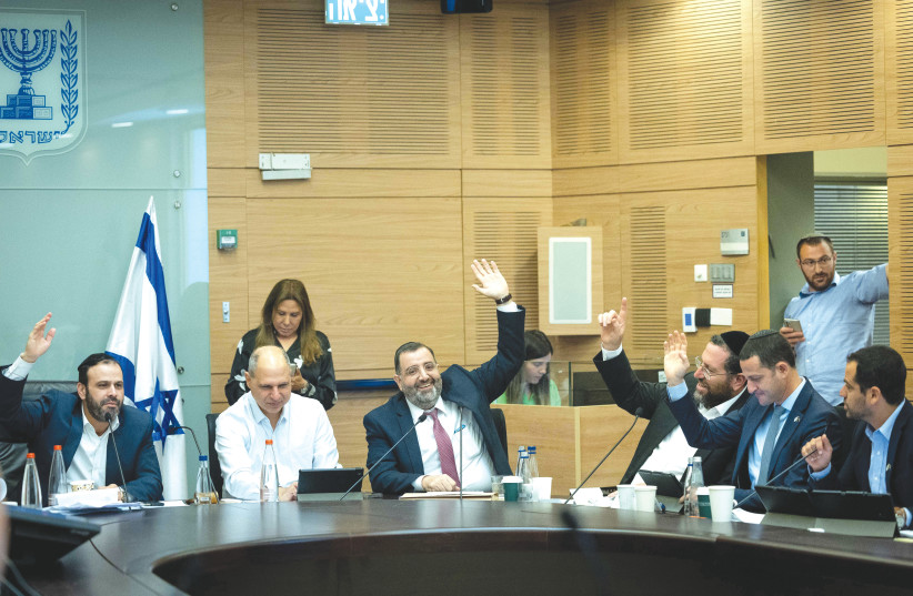   MK YINON AZOULAY and colleagues vote during a Finance Committee meeting at the Knesset on Tuesday. (photo credit: YONATAN SINDEL/FLASH90)