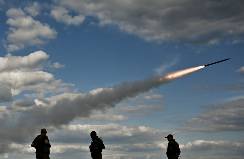 Ukrainian servicemen fire a Partyzan multiple launch rocket system towards Russian troops near a frontline, amid Russia's attack on Ukraine, in Zaporizhzhia region, Ukraine May 12, 2023 (photo credit: REUTERS/STRINGER)