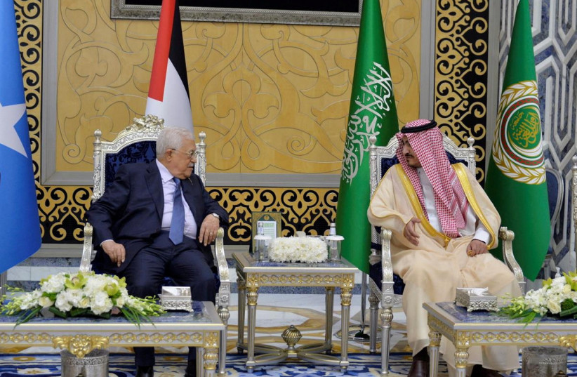  Palestinian President, Mahmoud Abbas, is received by Deputy Amir of Makkah, Prince Badr Bin Sultan, as he arrives to attend the Arab League Summit in Jeddah, Saudi Arabia, May 18, 2023. (photo credit: SAUDI PRESS AGENCY/HANDOUT VIA REUTERS)