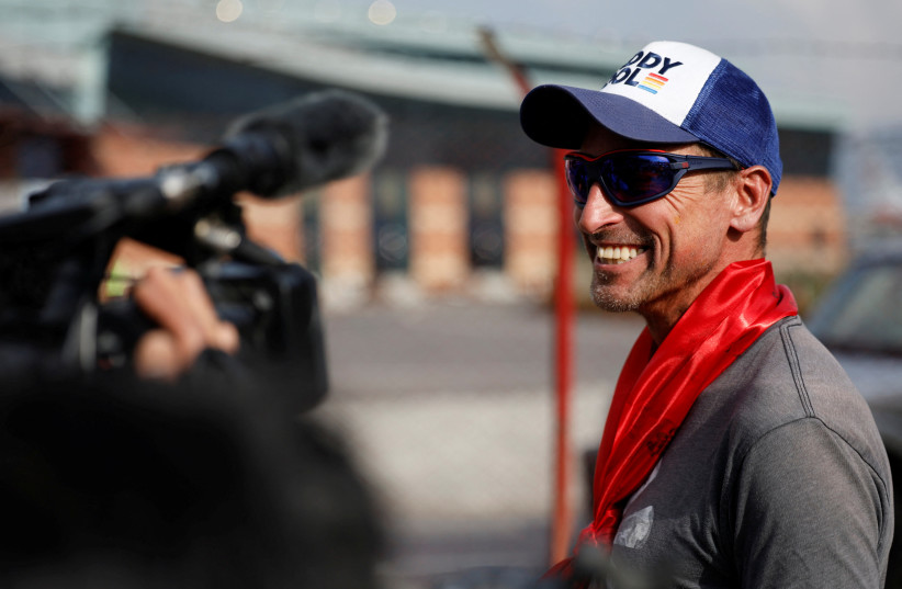 British climber Kenton Cool, 49, smiles while he speaks with the media personnel, upon his arrival at the airport, as he returns after completing his 17th ascent of Mount Everest, which is the most by any foreign climber, in Kathmandu, Nepal May 19, 2023. (credit: NAVESH CHITRAKAR/REUTERS)