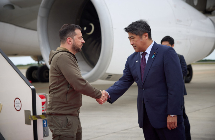 Ukraine's President Volodymyr Zelenskiy is greeted as he arrives at Hiroshima Airport to attend the G7 leaders' summit, in Mihara, Hiroshima prefecture, Japan May 20, 2023.  (photo credit: Ukrainian Presidential Press Service/Handout via REUTERS)