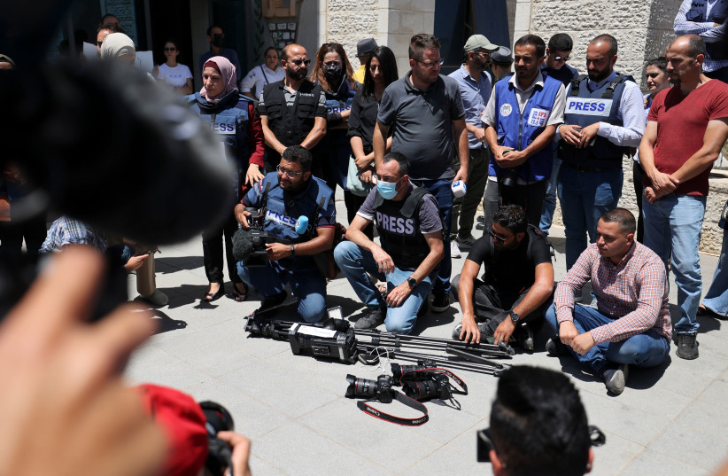  Journalists protest outside the United Nations office in the West Bank city of Ramallah on June 28, 2021, demanding protection following attacks by Palestinian security forces on their colleagues.  (credit: Abbas Momani/AFP via Getty Images)
