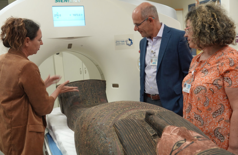 Prof. Ofer Merin, director-general of Shaare Zedek Medical Center oversees the CT scans of the ancient Egyptian coffin lids. (credit: SHAARE ZEDEK MEDICAL CENTER)