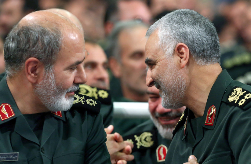  Iran's new Secretary of the Supreme National Security Council Ali Akbar Ahmadian is seen next to the late Iranian Major-General Qasem Soleimani during a meeting in Tehran, Iran, in this undated picture obtained on May 22, 2023. (photo credit: Office of the Iranian Supreme Leader/WANA/Handout via Reuters)