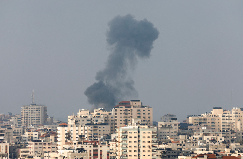Smoke rises following an Israeli strike, in Gaza May 12, 2023.