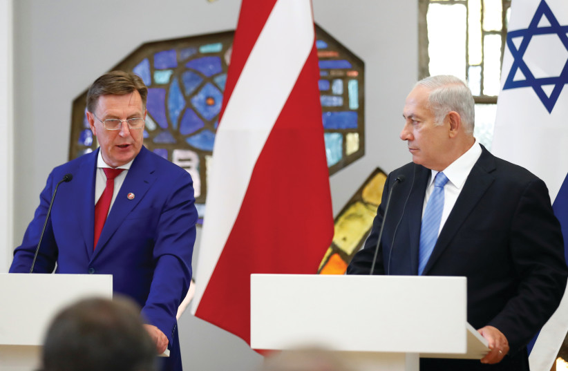  PRIME MINISTER Benjamin Netanyahu holds a news conference with then-Latvian prime minister Maris Kucinskis, in 2018.  (photo credit: Ints Kalnins/Reuters)