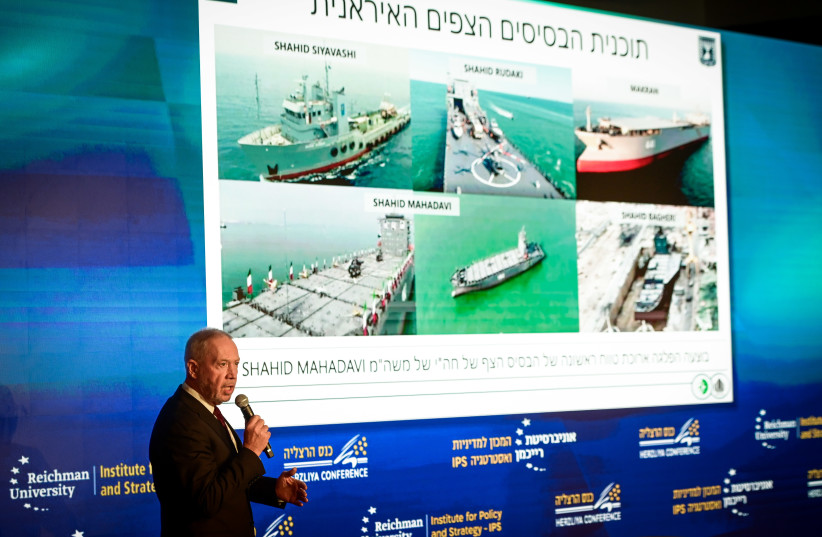  Defense Minister Yoav Gallant shows photographic evidence of Iranian ''floating terror bases'' in a conference in Herzliya on May 22, 2023 (credit: AVSHALOM SASSONI/FLASH90)
