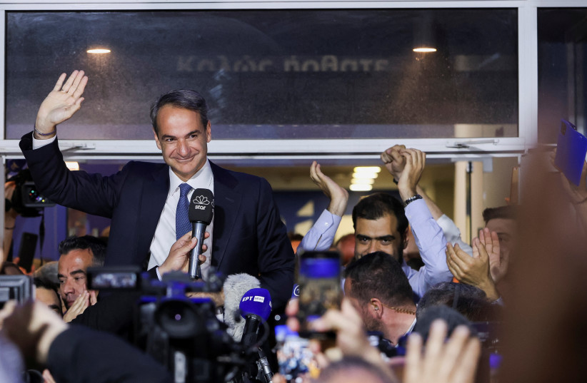  Greek Prime Minister and New Democracy conservative party leader Kyriakos Mitsotakis waves outside the party's headquarters, after the general election, in Athens, Greece, May 21, 2023. (credit: Louiza Vradi/Reuters)