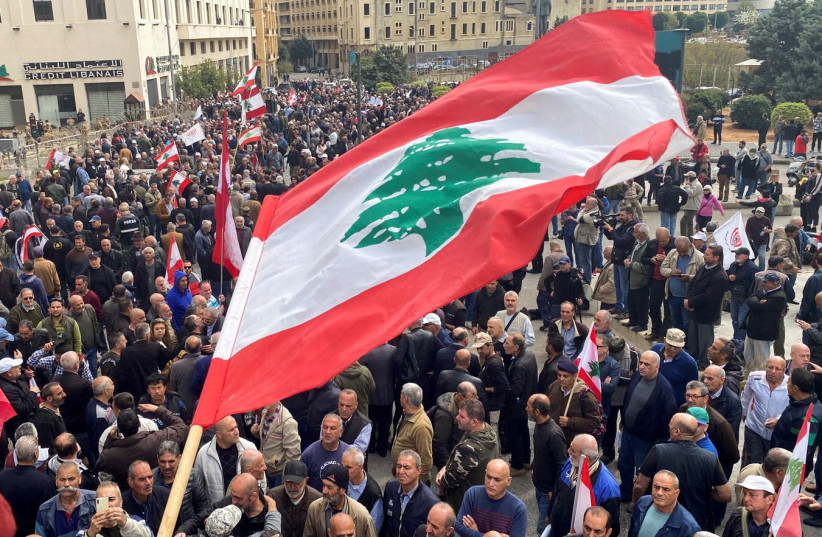  Demonstrators gather during a protest over the deteriorating economic situation, at Riad al-Solh square in Beirut, Lebanon March 22, 2023. (credit: REUTERS/MOHAMED AZAKIR)