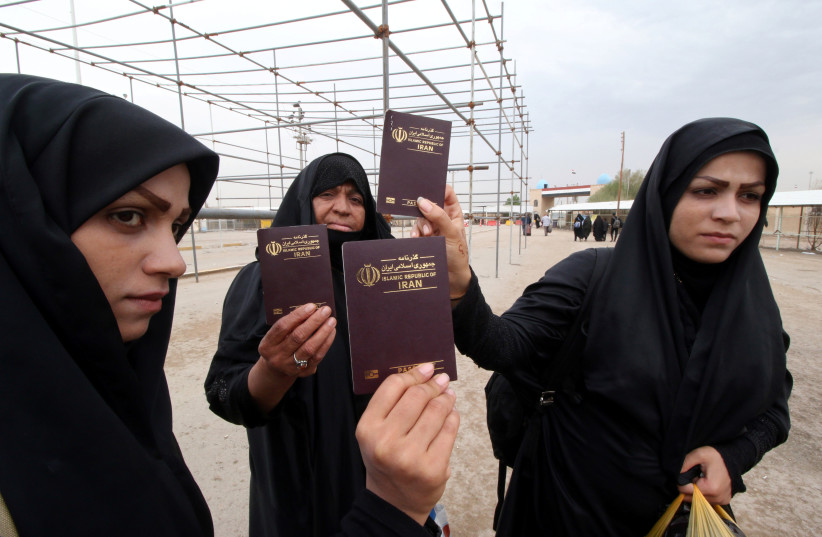 Iranian women show their passports at the Iraqi side of the Shalamcha Border Crossing, Iraq November 4, 2018. (credit: ESSAM AL-SUDANI/ REUTERS)