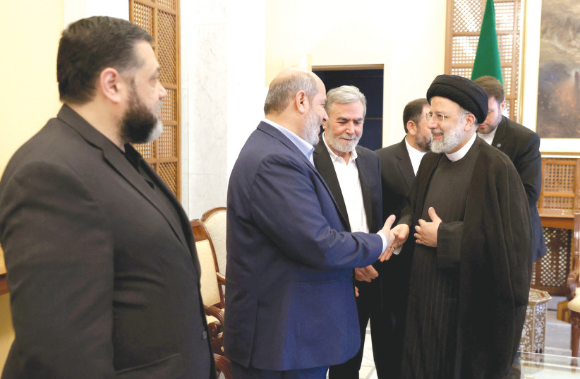  IRANIAN PRESIDENT Ebrahim Raisi meets with Palestinian Islamic Jihad Secretary-General Ziyad al-Nakhalah and other members of the PIJ, in Damascus, earlier this month.  (photo credit: IRAN PRESIDENCY/WEST ASIA NEWS AGENCY/REUTERS)