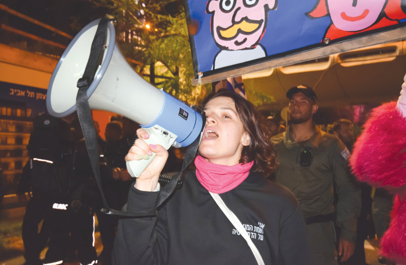  THE WRITER leads a demonstration on Kaplan Street, in Tel Aviv.  (photo credit: Gilad Bashan)