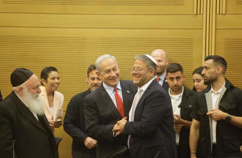  Prime Minister Benjamin Netanyahu and National Security Minister Itamar Ben-Gvir embrace ahead of the 2023 budget vote. (credit: MARC ISRAEL SELLEM/THE JERUSALEM POST)