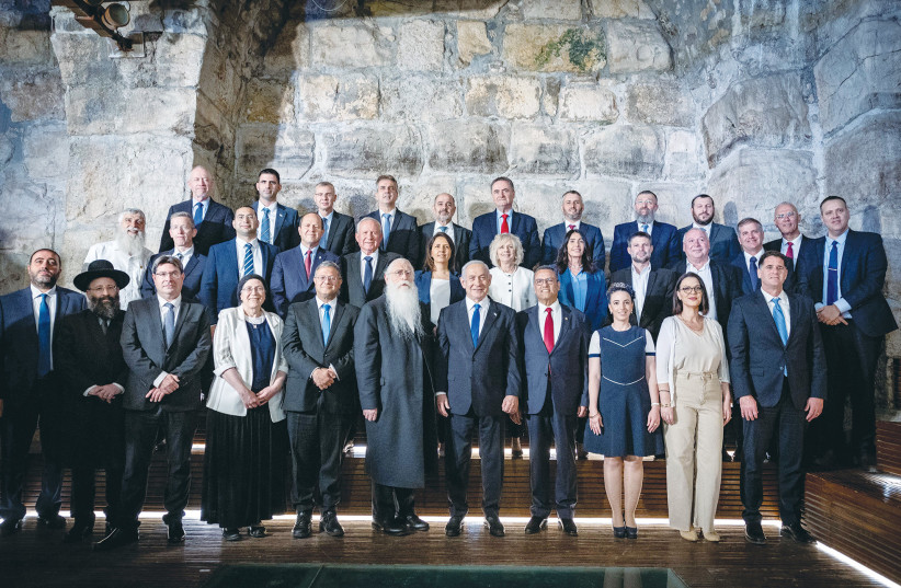  PRIME MINISTER Benjamin Netanyahu and his ministers, as well as Jerusalem Mayor Moshe Lion (right of Netanyahu), pose at the weekly cabinet meeting on Sunday, held at the Western Wall Tunnels to mark Jerusalem Day. (photo credit: YONATAN SINDEL/FLASH90)