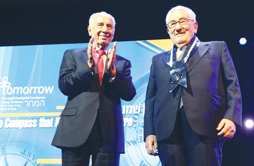 THEN-PRESIDENT Shimon Peres awards Henry Kissinger with Israel’s Presidential Award of Distinction, in Jerusalem, in 2012.  (photo credit: MIRIAM ALSTER/FLASH90)