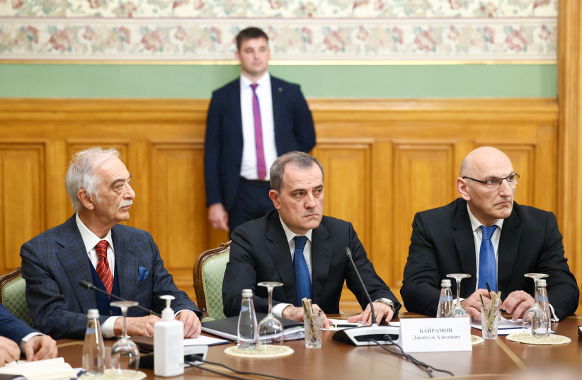 Azeri Foreign Minister Jeyhun Bayramov and members of the delegation attend a meeting with Russian and Armenian officials to defuse tensions between Azerbaijan and Armenia over the disputed territory of Nagorno-Karabakh, in Moscow, Russia, May 19, 2023.  (credit: RUSSIAN FOREIGN MINISTRY/HANDOUT VIA REUTERS)