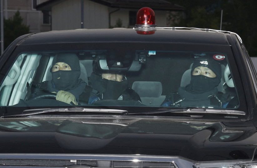 A car carrying a man who committed a shooting and stabbing incident enters the Nakano Police Station in Nakano, Nagano Prefecture, central Japan, in this photo taken by Kyodo on May 26, 2023. The man is unseen in this picture. (photo credit: KYODO/VIA REUTERS)
