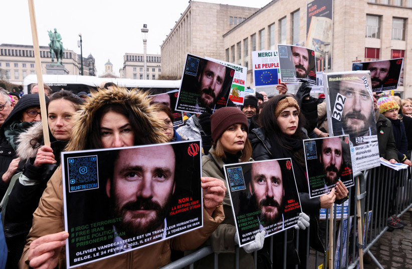People protest against the detention of Belgian aid worker Olivier Vandecasteele in Iran, who was sentenced to 40 years in prison and 74 lashes on charges including spying, in Brussels, Belgium January 22, 2023. (credit: YVES HERMAN/REUTERS)