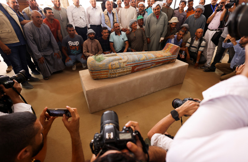 A sarcophagus found at the newly discovered site where two embalming workshops for humans and animals along with two tombs and a collection of artefacts were also found, near Egypt's Saqqara necropolis, in Giza, Egypt May 27, 2023 (credit: REUTERS/AMR ABDALLAH DALSH)