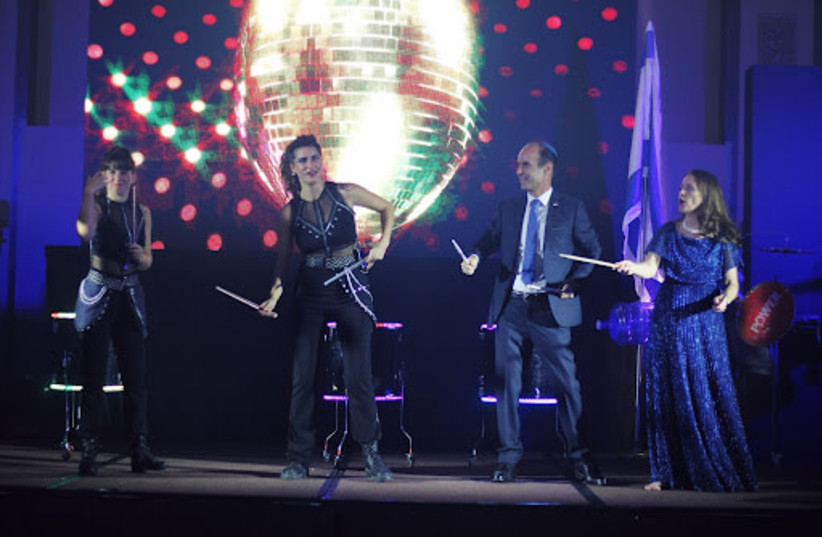 Ambassador Ilan Fluss and his wife Gila on stage with Rhythmnaia   (credit: Embassy of israel in Philippines)