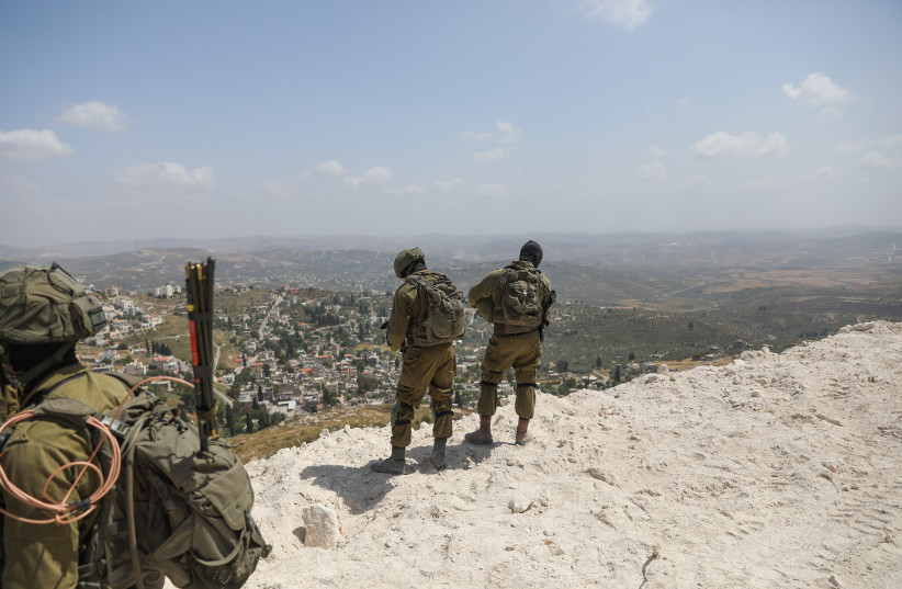  Israeli soldiers guard at the outpost of Homesh, in the West Bank, on May 29, 2023.  (credit: FLASH90)