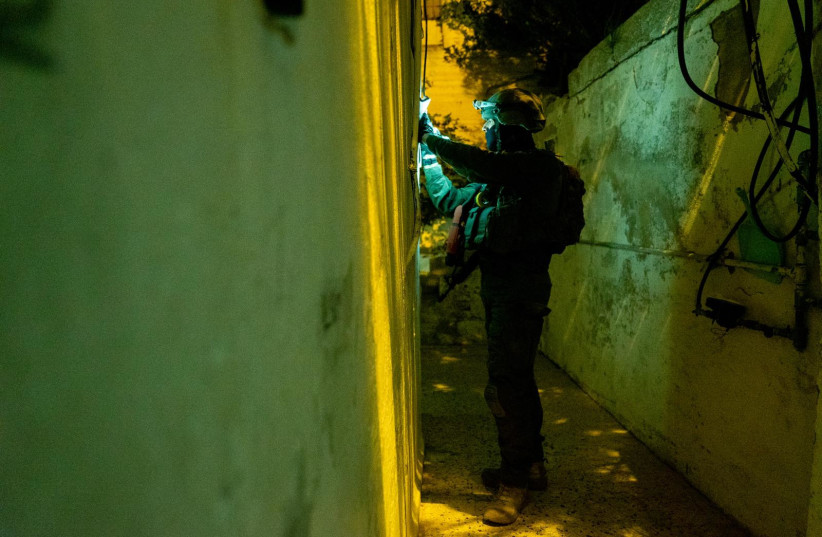  An IDF soldier takes measurements of a Nablus home ahead of a planned demolition on May 30, 2023 (credit: IDF SPOKESPERSON'S UNIT)