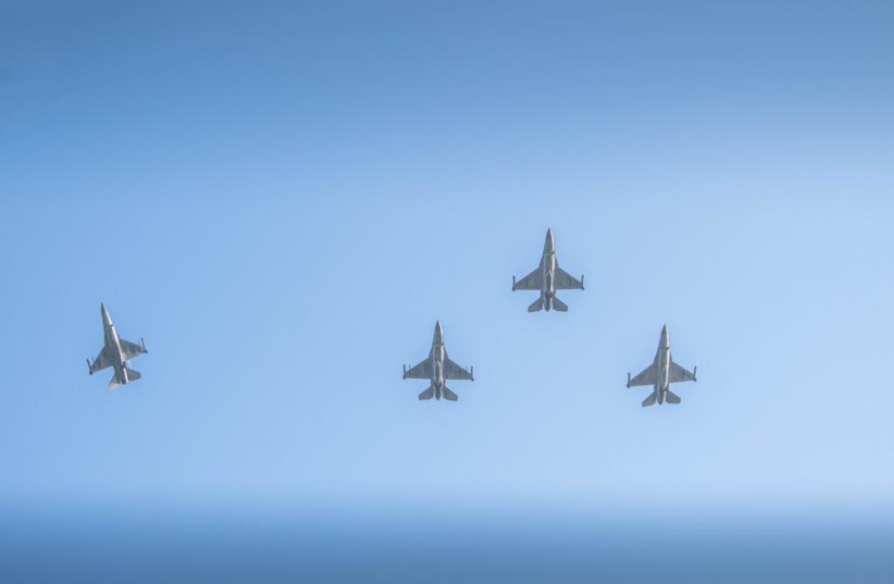  IAF fighter jets are seen at a ceremony commemorating 75 years since Israel's first-ever airstrike. One plane flies off to the side, in memory of the late Eddie Cohen, who died in the battle, at Ad Halom near Ashdod, on May 29, 2023. (credit: IDF SPOKESPERSON'S UNIT)