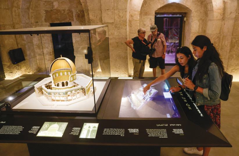  VISITORS interact with a computerized model of the Temple Mount complex, next to a model of the Dome of the Rock. (credit: MARC ISRAEL SELLEM)