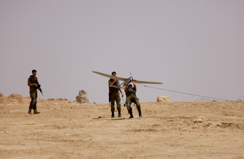  A soldier launches an unmanned aerial vehicle near the site of a reported security incident near Israel's southern border with Egypt, Israel June 3, 2023. (credit: REUTERS/AMIR COHEN)