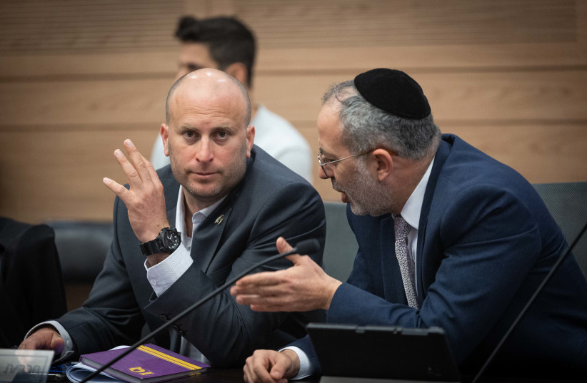  MK Yitzhak Kroizer (L) attends a Constitution committee meeting at the Knesset, the Israeli Parliament in Jerusalem, on February 28, 2023 (credit: YONATAN SINDEL/FLASH90)