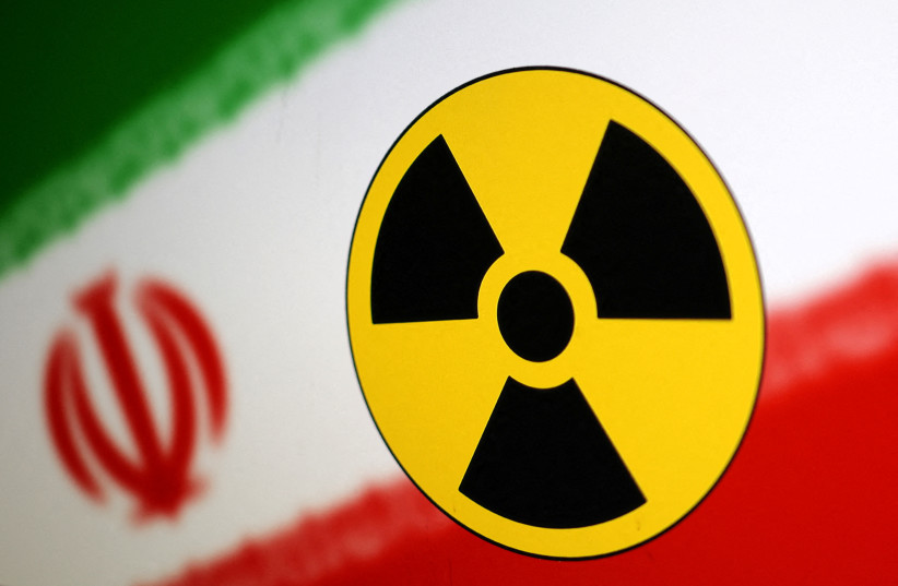  Nuclear symbol and Iran flag are seen in this illustration, July 21, 2022 (credit: DADO RUVIC/REUTERS ILLUSTRATION)