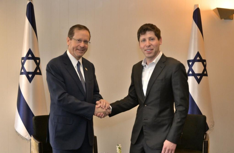  President Herzog (left) shakes hands with OpenAI CEO Sam Altman (right). (credit: AMOS BEN GERSHOM/GPO)