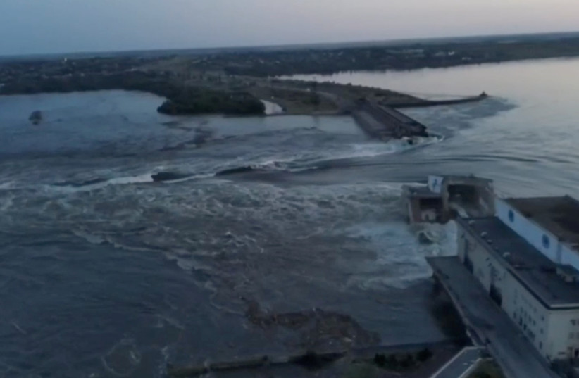  A general view of the Nova Kakhovka dam that was breached in Kherson region, Ukraine June 6, 2023 in this screen grab taken from a video obtained by Reuters. (credit: REUTERS)