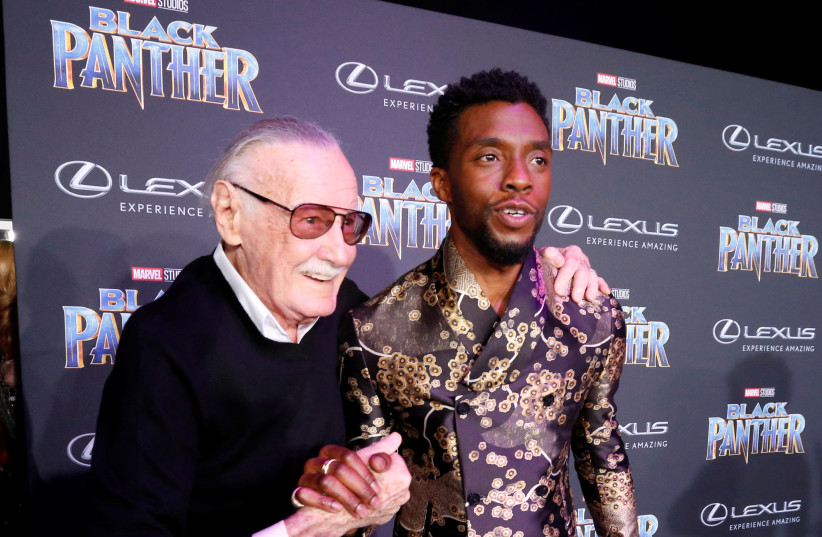 Stan Lee (L) greets cast member Chadwick Boseman at the premiere of ''Black Panther'' in Los Angeles, California, US, January 29, 2018 (credit: MARIO ANZUONI/REUTERS)