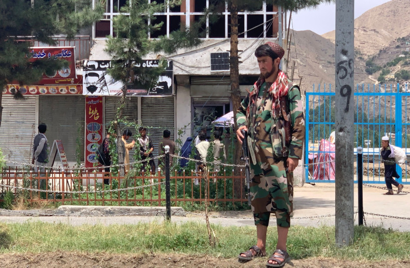  A member of Taliban stands guard near the site of a suicide attack in Faizabad district of Badakhshan province on June 6, 2023.  (credit: OMER ABRAR/AFP via Getty Images)