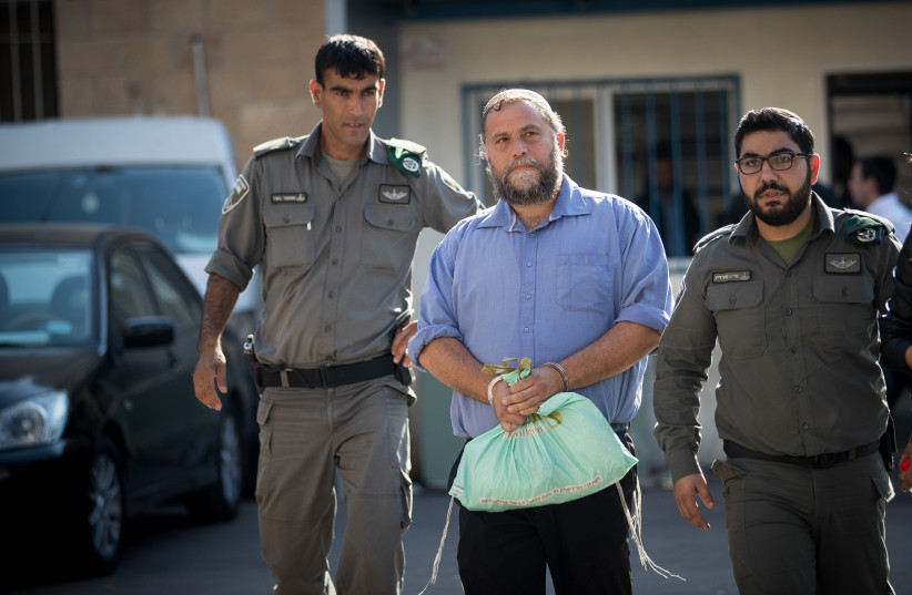  Lehava chairman Benzi Gopstein is brought to the Jerusalem Magistrate's Court after he was arrested by police earlier today, October 22, 2017. (credit: YONATAN SINDEL/FLASH90)
