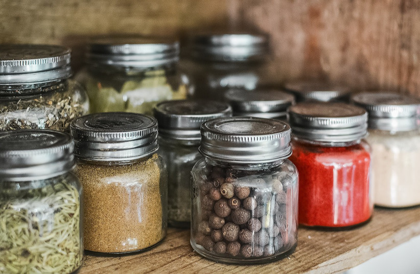  Glass jars filled with spices (illustrative). (credit: PIXABAY)