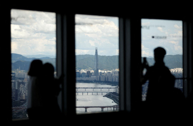 Lotte Group's 123-storey skyscraper Lotte World Tower is seen from an observation platform in Seoul, South Korea, August 11, 2017. (credit: REUTERS/KIM HONG-JI/FILE PHOTO)