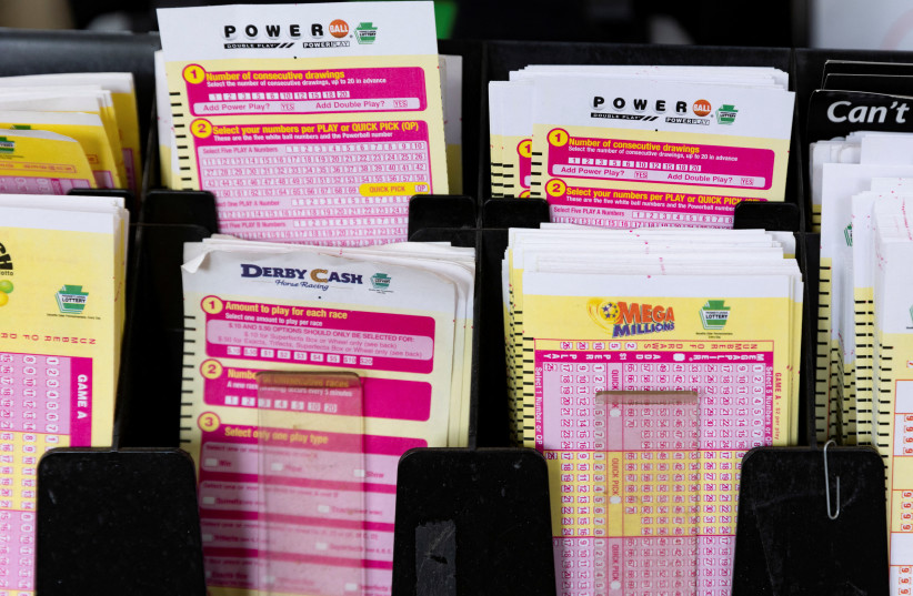  Lottery tickets are pictured as the Powerball lottery jackpot hits $1 billion in Doylestown, Pennsylvania, U.S. October 31, 2022. (credit: REUTERS/HANNAH BEIER)